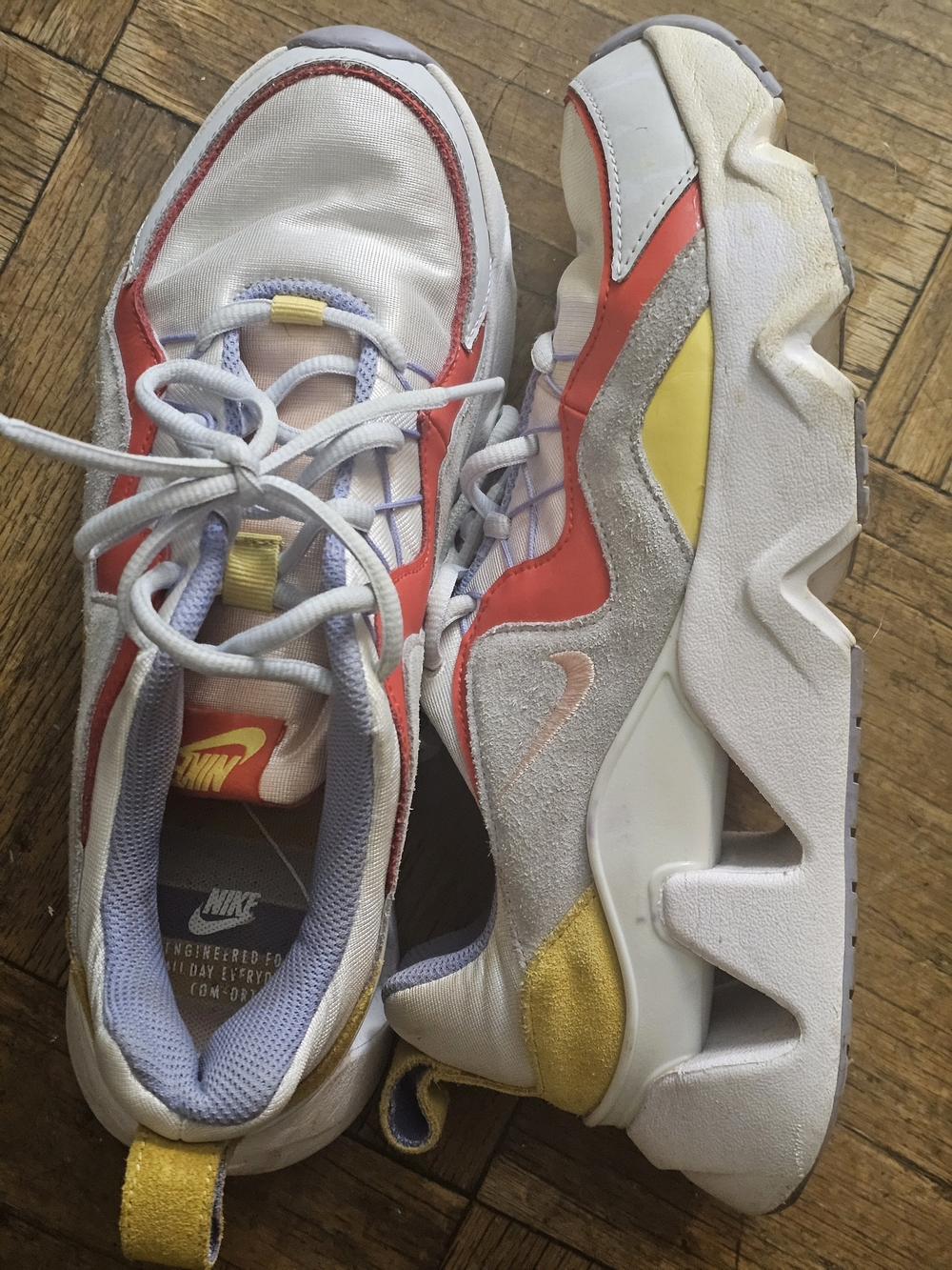 Nike Women's White Sneakers with Red and Yellow Accents